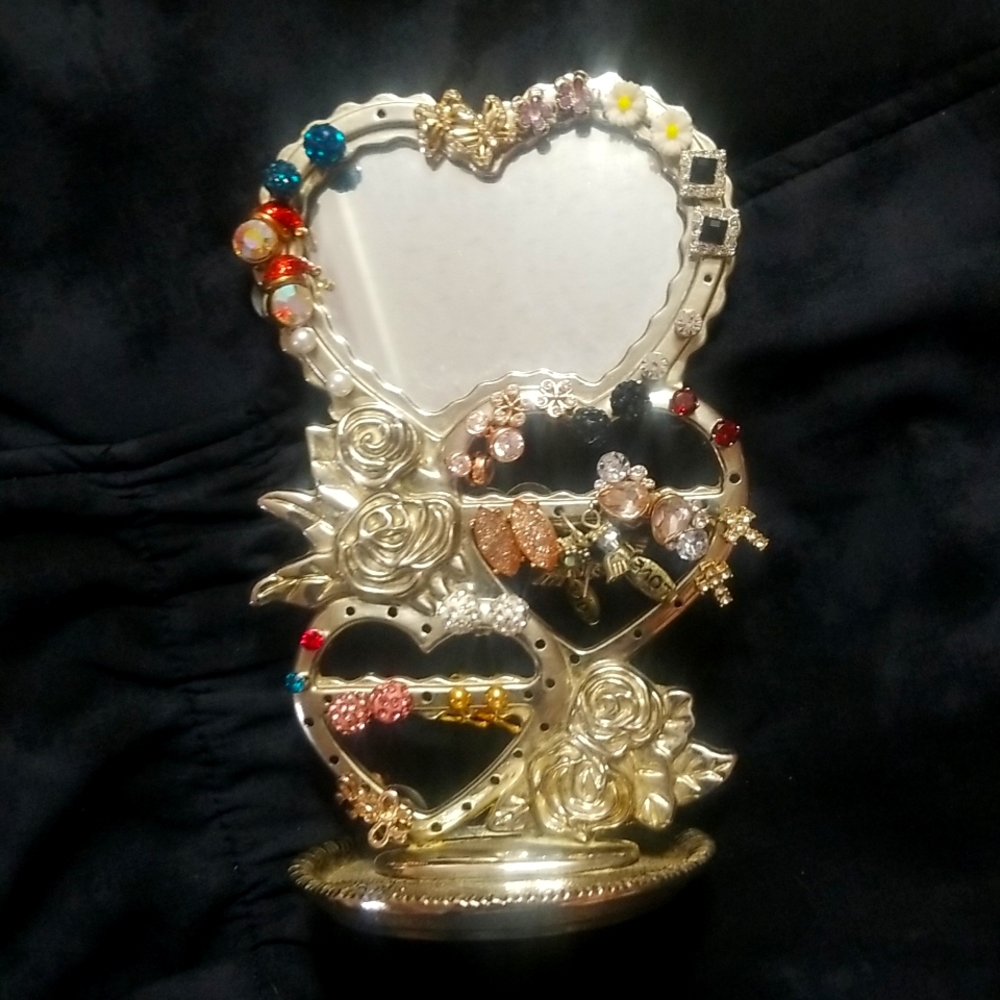 21 lab created earings with heart shape holder purchased each pair for 27.oo